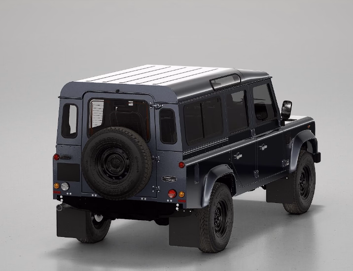 Defender restaurado pelo Works V8 em cinza documental visto em três quartos traseiros no estúdio