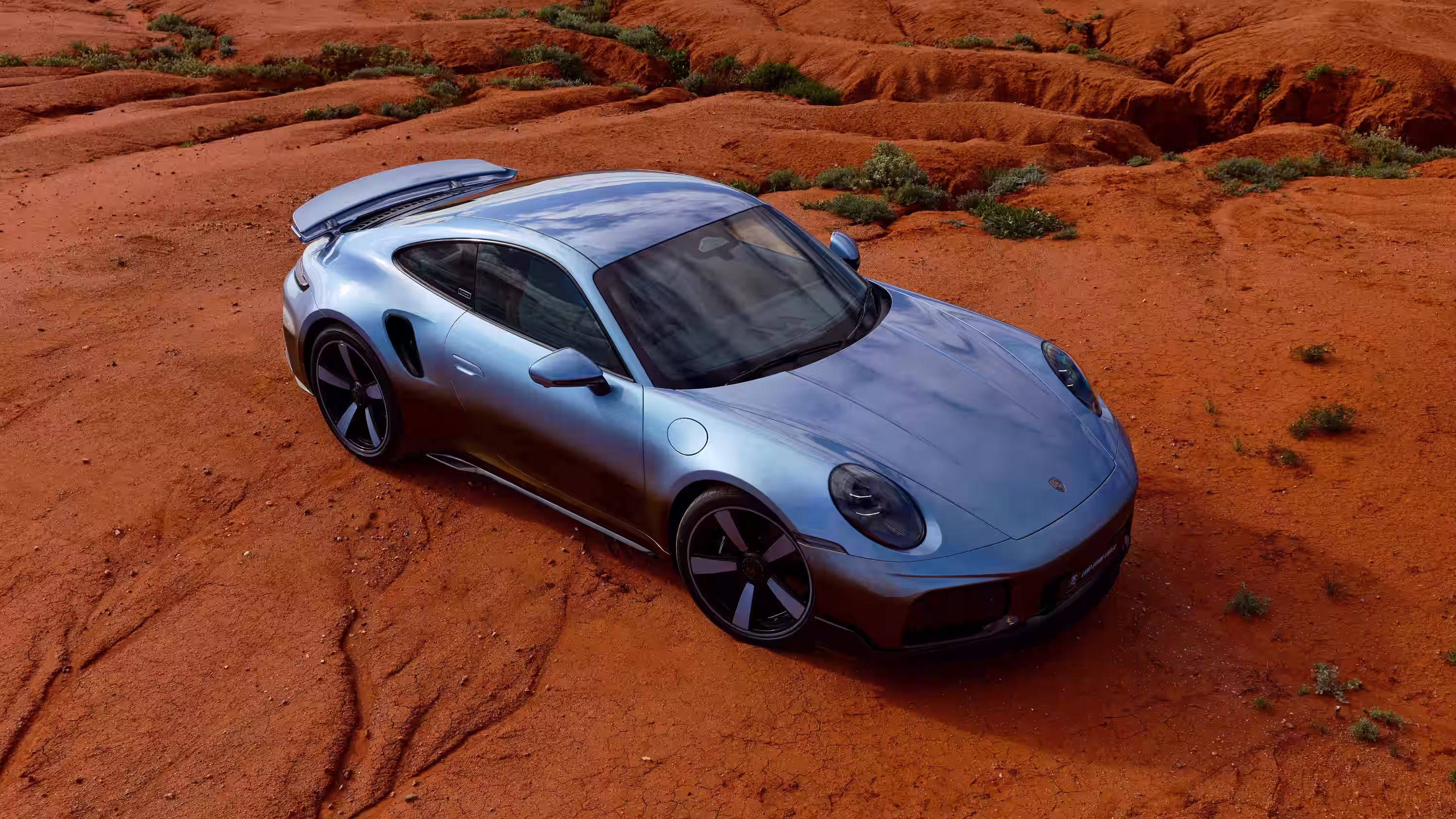 Porsche 911 Turbo S Land Down Under visto sobre a terra vermelha