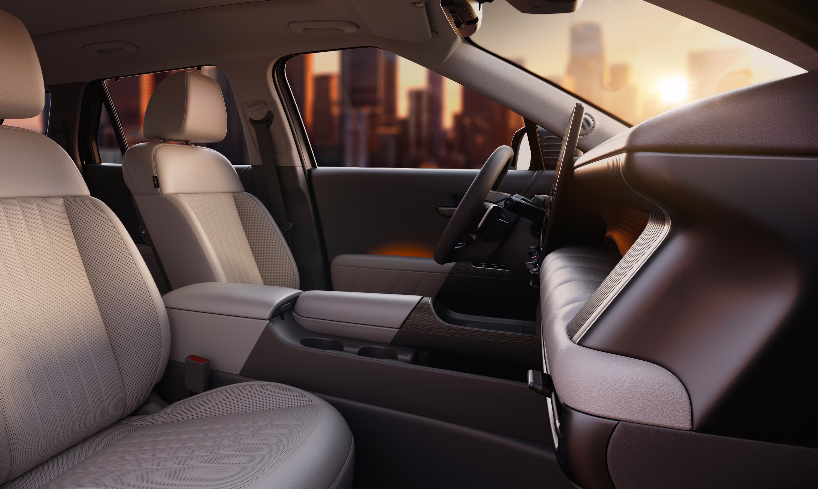 Imagem de divulgação dos bancos dianteiros do Hyundai Tucson com console central e painel vistos pelo lado do passageiro