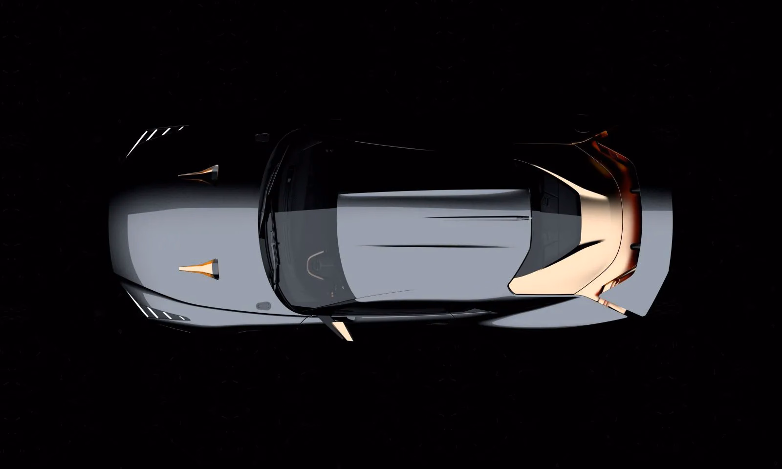 GT-R50 cinza e dourado visto diretamente de cima no material de apresentação